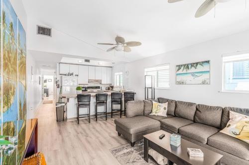 a living room with a couch and a kitchen at Ocean Oasis III in Key Colony Beach