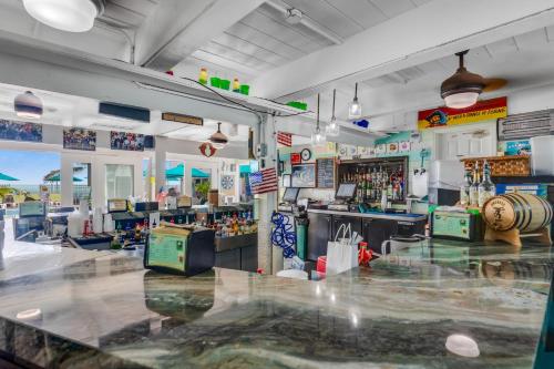 a room with a bar with a lot of alcohol at Ocean Oasis III in Key Colony Beach
