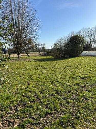 Zahrada ubytování Longère normande avec piscine et jardin