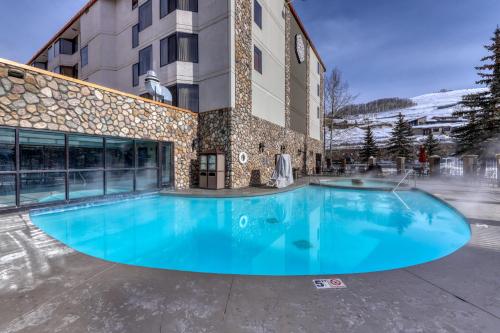 a large swimming pool in front of a building at Grand Lodge #151 in Crested Butte