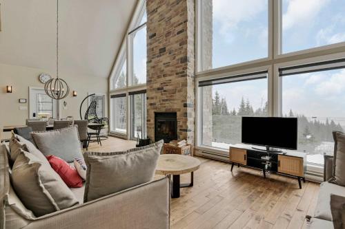 Et tv og/eller underholdning på Manwë - Evasion Panoramique - Spa & Jeux