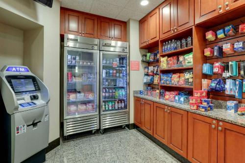 a grocery store aisle with a vending machine in a store at Drury Inn & Suites Charlotte Arrowood in Charlotte