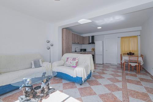 a living room with a couch and a table at Casa de la Abuela Primero in Quéntar
