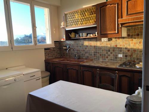 a kitchen with a sink and a counter top at Maison face mer ! in Pornichet