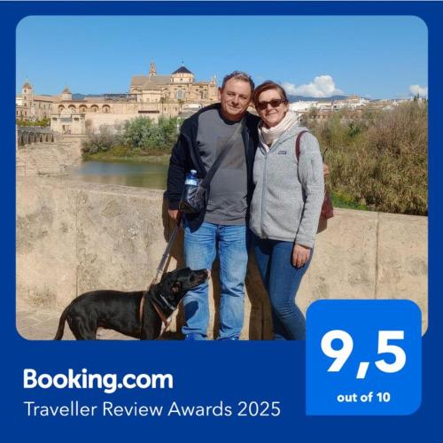 two people and a dog posing for a picture at Casa Paraiso in Almería