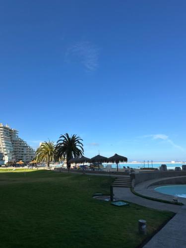 a park with a view of the beach and buildings at San Alfonso del Mar la mejor vista de Algarrobo in Algarrobo