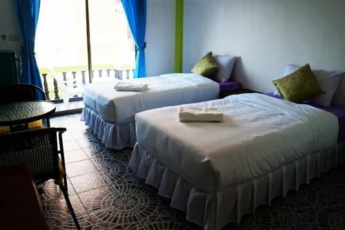 Katil atau katil-katil dalam bilik di Nong Guest House