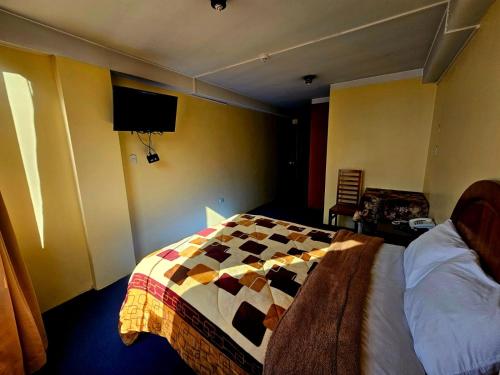 Giường trong phòng chung tại Julio Cesar HOTELES