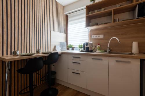 RP Apartmanházにあるキッチンまたは簡易キッチン