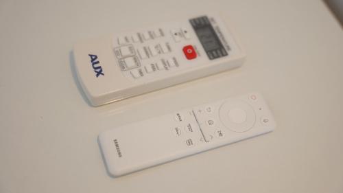 two remote controls sitting on top of a table at Il Vicoletto B&B in Cirò Marina