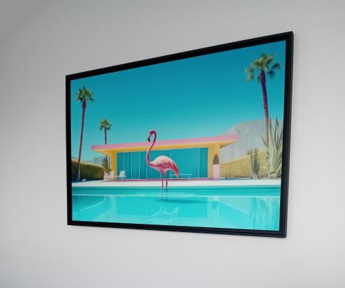 a framed picture of a flamingo standing in a swimming pool at theSocial Liveur- SOHO- LES CHARTRONS in Bordeaux