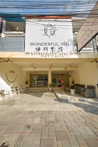 a building with a sign on the side of it at Wonderful Life in Pattaya