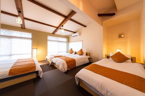 Postel nebo postele na pokoji v ubytování 伏見稲荷のお宿 伏見とき 寝室3つ Bed 8台