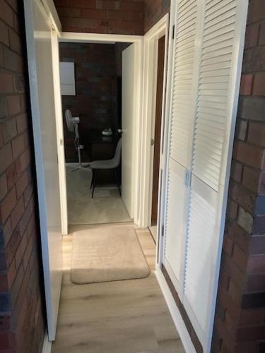 a hallway with a door leading to a room at Wynyardway in Tumut