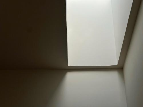 a window on the ceiling of a room at Jun Home - Dalat in Da Thanh