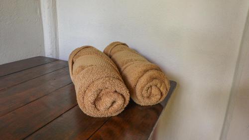 a couple of towels hanging on a wall at Rio Celeste Cabinas Vista Tenorio in El pilon