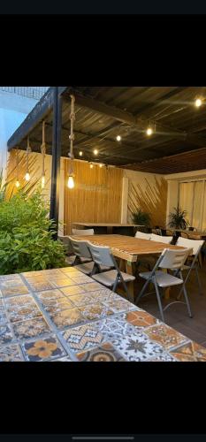 a patio with a table and chairs on a patio at La Quinta De Conin in Miranda