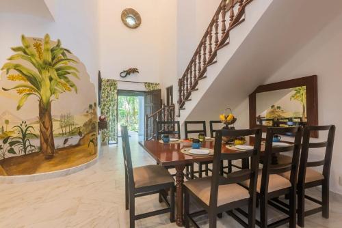 a dining room with a table and chairs at Villa Beach Adventure Relax Holiday Private Pool BBQ Maid Service Golf in Playa del Carmen