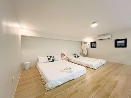 Ένα ή περισσότερα κρεβάτια σε δωμάτιο στο THE KABIN LOFT in Pampanga