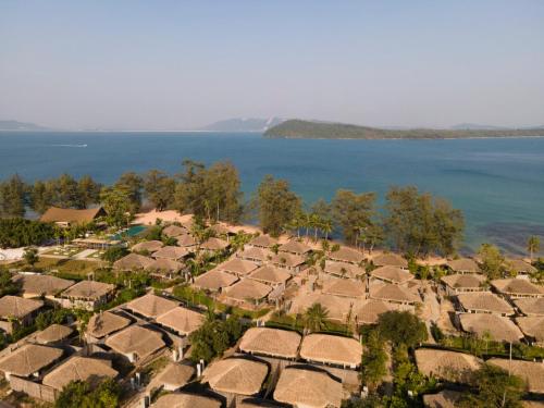 an aerial view of a village by the water at JATI Koh Russey in Sihanoukville