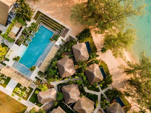 an overhead view of a pool on a beach at JATI Koh Russey in Sihanoukville
