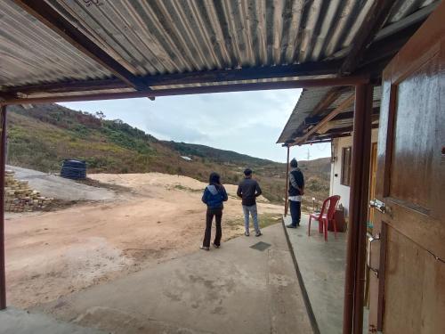 a group of people standing outside of a building at Lawanba Home Stay in Dum-Dum Junction