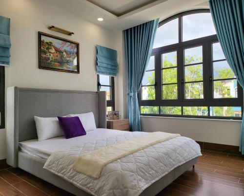 Postel nebo postele na pokoji v ubytování Biệt thự biển Novaworld Phan Thiết