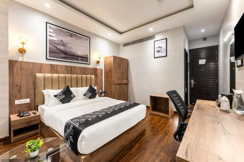 a hotel room with a bed and a desk at Medalio Boutique Gangtok with Mountain View in Gangtok