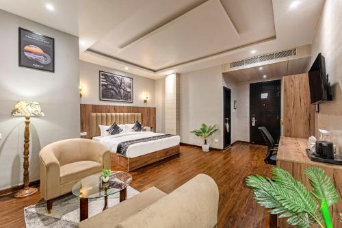 a bedroom with a bed and a living room at Medalio Boutique Gangtok with Mountain View in Gangtok