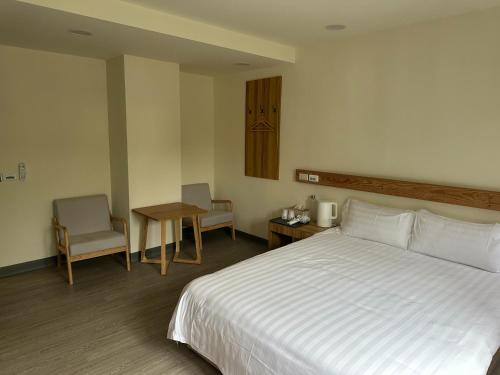 Postel nebo postele na pokoji v ubytování 慢且洄瀾文旅 Bantshiann Hualie Hotel