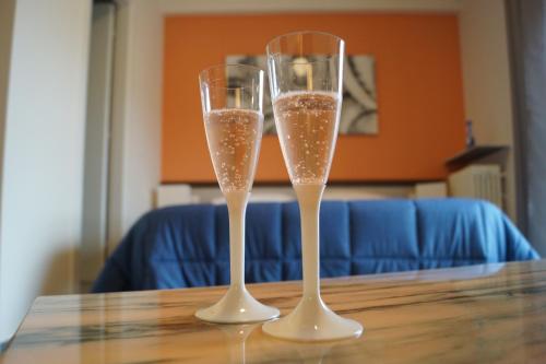 two glasses of champagne sitting on a table at Dimore Le Lucane in Matera