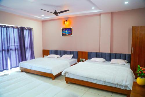 Ein Bett oder Betten in einem Zimmer der Unterkunft Hotel Dev Krishna Palace