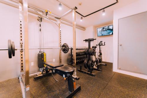a fitness room with a gym with a treadmill at Minimalist Loft 4 Namba Compact Studio and Gym MA405 in Osaka