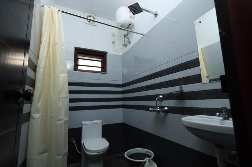 Koupelna v ubytování Ganjes Premium Villa Thekkady