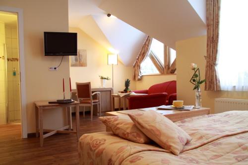 En eller flere senge i et værelse på Dreimädelhaus - Kirchseelte