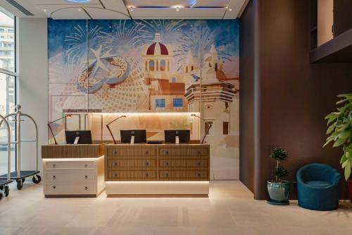 an office with a large mural on the wall at Hyatt Centric Malta in St. Julianʼs