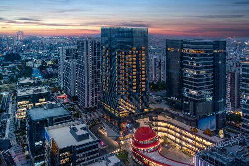 an overhead view of a city at night at Wyndham Hotel Guangzhou Huangbian Metro Branch - Free shuttle bus to Canton Fair in Guangzhou