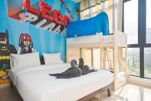 a bedroom with a bunk bed with a batman bedroom at D'Pristine Theme Suite by Nest Home at LEGOLAND in Nusajaya