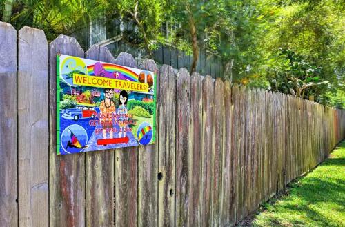 a sign hanging on a wooden fence at Yonegan Maui Getaways - Haiku in Haiku