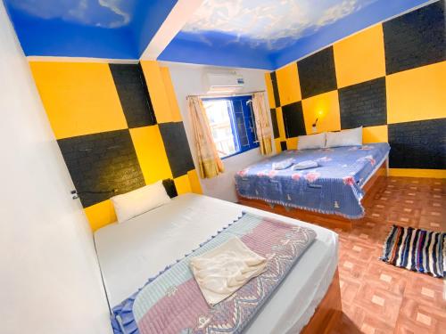 Postel nebo postele na pokoji v ubytování Vang Vieng Ruby Backpackers Hostel