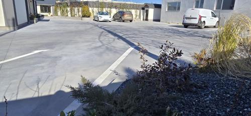 a street with cars parked in a parking lot at Tempo Boutique in Buzau