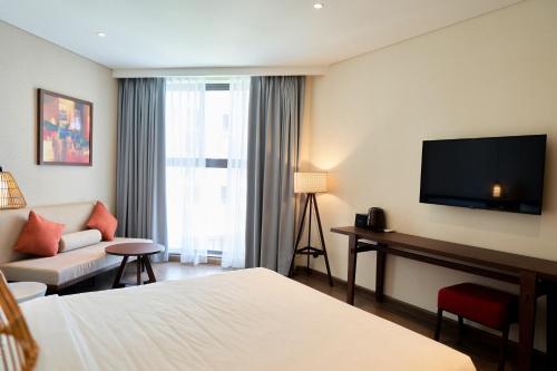 The Apec Mandala Ocean View Mui Ne - Condotelにあるベッド