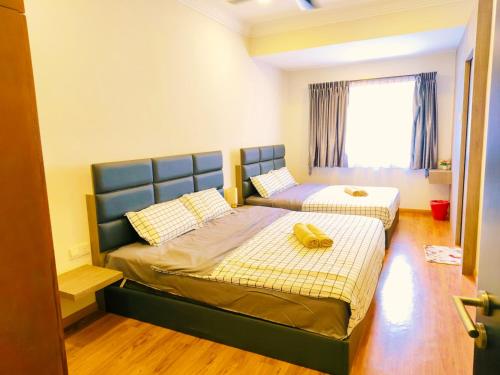 Letto o letti in una camera di Area Bandar Putra Kulai 4-6BR near AEON IOI Airport