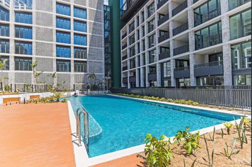 an image of a swimming pool in front of a building at Lidcombe Apt Near Olympic Park Train in Sydney