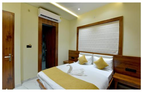 a bedroom with a white cat laying on a bed at Yashvrinda in Mandor