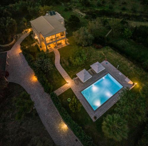 an overhead view of a house with a swimming pool at Villa Stefania in Agios Georgios Pagon