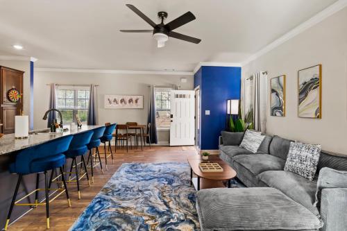 a living room with a couch and a bar at Cozy & Spacious 2 King Beds Near UGA & Downtown in Athens