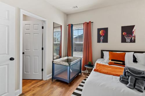 a bedroom with a bed and a window at Cozy & Spacious 2 King Beds Near UGA & Downtown in Athens