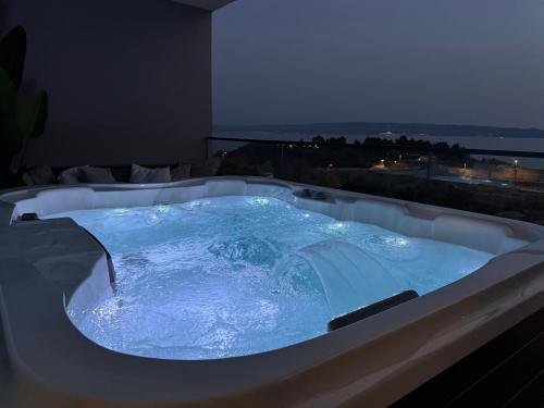 a jacuzzi tub in a room with a view at Luxury apartment L with jacuzzi in Split