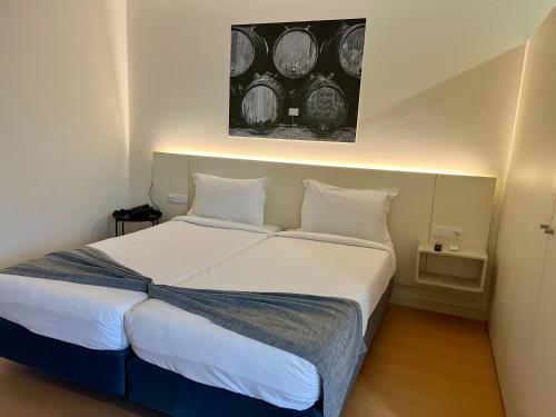 Giường trong phòng chung tại Hotel Areosa